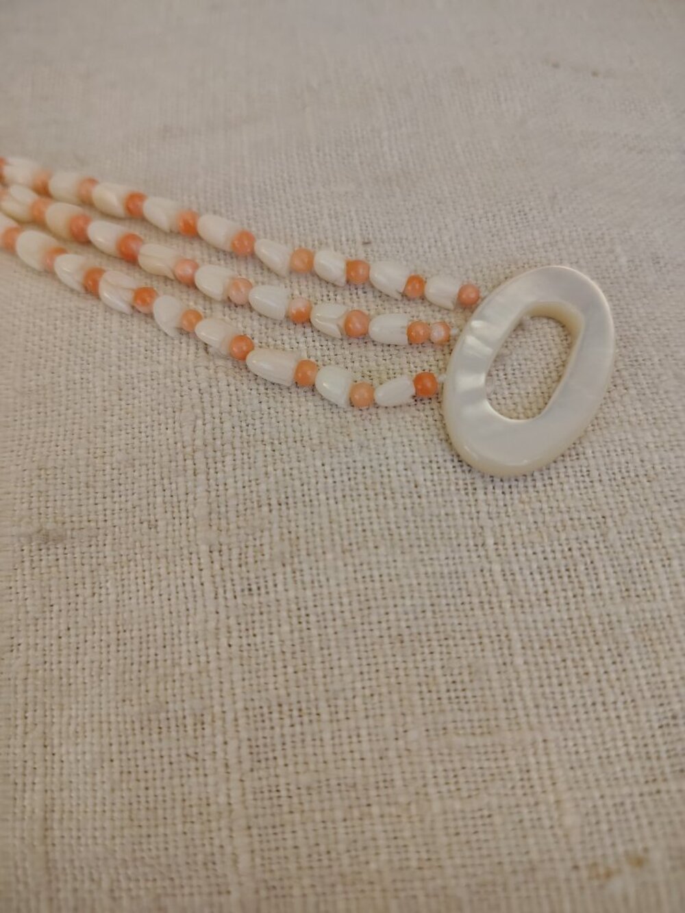 Tulip style peach and white beaded triple strand bracelet